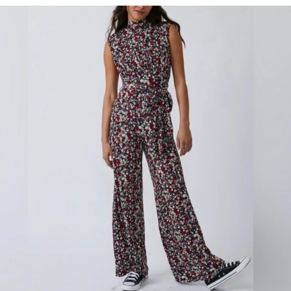 Free people open back tie waist wide leg Floral Black jumpsuit size small
